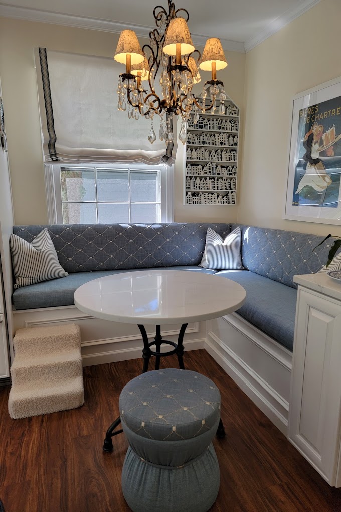 A beautifully upholstered furniture piece in a breakfast nook setting
